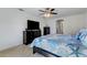 Main bedroom with king bed, dresser, and ensuite access at 19304 Bluff Dr, Venice, FL 34292