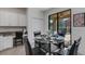 Kitchen breakfast nook with glass table and four chairs at 19304 Bluff Dr, Venice, FL 34292