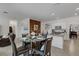 Open dining area with a round glass table and leather chairs at 19304 Bluff Dr, Venice, FL 34292