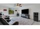 Relax in this home theater, featuring plush seating and a large screen TV at 19304 Bluff Dr, Venice, FL 34292
