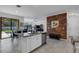 Modern kitchen with white cabinets, granite island, and stainless steel appliances at 19304 Bluff Dr, Venice, FL 34292