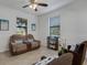 Relaxing living room featuring comfortable seating and large windows at 19304 Bluff Dr, Venice, FL 34292