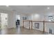Upper level hallway with tile flooring and natural light at 19304 Bluff Dr, Venice, FL 34292