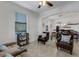 Relaxing living room with comfortable seating and access to dining area at 19304 Bluff Dr, Venice, FL 34292