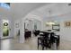 Open concept dining area with view to entryway and living room at 19304 Bluff Dr, Venice, FL 34292