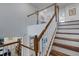 Elegant staircase with wooden treads and white railings at 19304 Bluff Dr, Venice, FL 34292