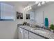 Bathroom with double vanity and granite countertop at 19304 Bluff Dr, Venice, FL 34292