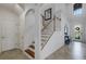 Elegant staircase leading to the upper level of the home at 19304 Bluff Dr, Venice, FL 34292