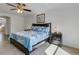 Bright and airy main bedroom with a king bed and ensuite access at 19304 Bluff Dr, Venice, FL 34292