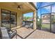 Covered patio with comfortable seating overlooking the pool at 19304 Bluff Dr, Venice, FL 34292