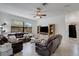 Bright living room with leather sofas and built-in shelving at 19304 Bluff Dr, Venice, FL 34292