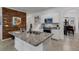 Modern kitchen with white cabinets, granite counters, and stainless steel appliances at 19304 Bluff Dr, Venice, FL 34292