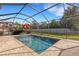 Inviting screened-in pool with ample deck space at 19304 Bluff Dr, Venice, FL 34292