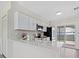 Modern kitchen with white cabinets and quartz countertops at 2616 Osage Rd, Venice, FL 34293