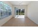 Sunroom with tile floors and sliding glass doors leading to the outdoors at 1622 Monarch Dr # 1622, Venice, FL 34293