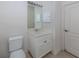 Simple bathroom with toilet and vanity with storage at 1622 Monarch Dr # 1622, Venice, FL 34293