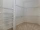 Large walk-in closet with wire shelving units at 1622 Monarch Dr # 1622, Venice, FL 34293