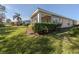 View of the house exterior and backyard at 1622 Monarch Dr # 1622, Venice, FL 34293