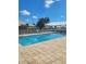 Inviting community pool with patio and surrounding landscaping at 1622 Monarch Dr # 1622, Venice, FL 34293