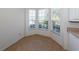 Kitchen nook with tile flooring and a large bay window at 1622 Monarch Dr # 1622, Venice, FL 34293