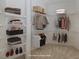 Spacious walk-in closet with wire shelving; virtually staged at 1622 Monarch Dr # 1622, Venice, FL 34293