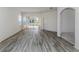 Living room with wood-look floors and views of the backyard at 1622 Monarch Dr # 1622, Venice, FL 34293