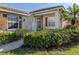 House exterior showcasing the front entrance with lush landscaping at 1622 Monarch Dr # 1622, Venice, FL 34293