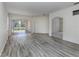Spacious living area with wood-look floors and multiple access points at 1622 Monarch Dr # 1622, Venice, FL 34293