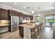 Modern kitchen with stainless steel appliances and breakfast bar at 25159 Spartina Dr, Venice, FL 34293