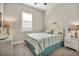 Bedroom with a queen-size bed and coastal decor at 25143 Spartina Dr, Venice, FL 34293