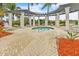 Community hot tub with pergola and lounge chairs at 25143 Spartina Dr, Venice, FL 34293