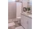 Bathroom with a walk-in shower, white vanity, and granite countertop at 17505 Belle Eden Way, Nokomis, FL 34275