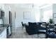 Open concept living room, kitchen, and dining area with modern finishes at 17505 Belle Eden Way, Nokomis, FL 34275