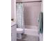 Clean bathroom with a tub, shower, and updated fixtures at 17505 Belle Eden Way, Nokomis, FL 34275