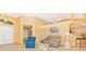 Open living area with seating, a view into the kitchen, and tiled floors at 16093 Hillsborough Blvd, Port Charlotte, FL 33954