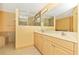 Bathroom boasts double sinks and a large mirror at 16093 Hillsborough Blvd, Port Charlotte, FL 33954