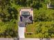 Aerial view of the house, pool, and surrounding area at 16093 Hillsborough Blvd, Port Charlotte, FL 33954