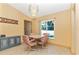 Small dining area with a table for four, and a view of the pool at 16093 Hillsborough Blvd, Port Charlotte, FL 33954