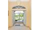 Bright entryway with tiled floors and double doors leading to the backyard at 16093 Hillsborough Blvd, Port Charlotte, FL 33954