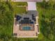 Aerial view showing house, pool, and solar panels at 16093 Hillsborough Blvd, Port Charlotte, FL 33954