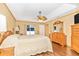 Main bedroom with wood floors and ceiling fan at 16093 Hillsborough Blvd, Port Charlotte, FL 33954