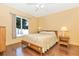 Bright bedroom with wood flooring and a comfortable bed at 16093 Hillsborough Blvd, Port Charlotte, FL 33954