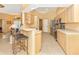 Kitchen boasts light wood cabinets and stainless steel appliances at 16093 Hillsborough Blvd, Port Charlotte, FL 33954