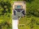 Aerial view of house with solar panels and pool at 16093 Hillsborough Blvd, Port Charlotte, FL 33954