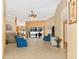 Spacious living room with tiled floors, comfy seating, and access to the pool at 16093 Hillsborough Blvd, Port Charlotte, FL 33954