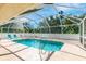 Inviting screened pool area with patio and lounge chairs at 16093 Hillsborough Blvd, Port Charlotte, FL 33954