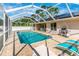 Spacious pool area with patio furniture and grill at 16093 Hillsborough Blvd, Port Charlotte, FL 33954