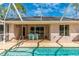Screened pool and patio with solar panels at 16093 Hillsborough Blvd, Port Charlotte, FL 33954