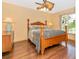 Spacious bedroom with wood floors and a ceiling fan at 16093 Hillsborough Blvd, Port Charlotte, FL 33954