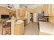 Open concept kitchen with island and stainless steel appliances at 16093 Hillsborough Blvd, Port Charlotte, FL 33954